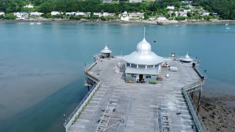 bangor seaside pier north wales silver spire pavilion low tide aerial view rear rising pull away