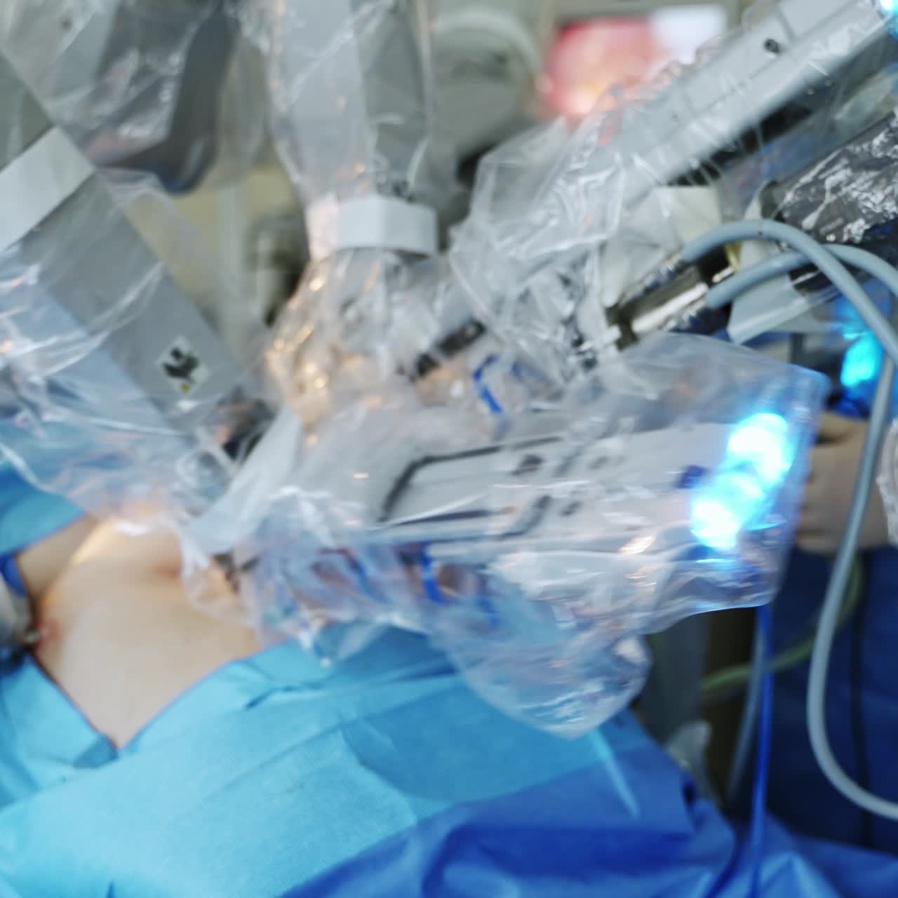 Minimally invasive robotic surgery in operating room. Medical surgical robot doing operation on patient. Hi-tech medical robot.