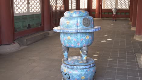 traditional blue incense burner with floral patterns at gyeongbokgung palace. jongno district, seoul, south korea. closeup, wide shot