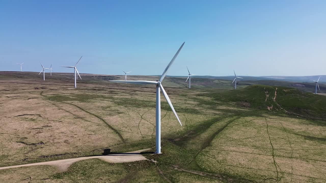 Aerial view of wind turbines farm to produce clean renewable sustainable energy target netzero