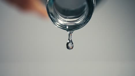 last drop of water falling down from a water bottle, stay hydrated, closeup, highspeed, slowmotion