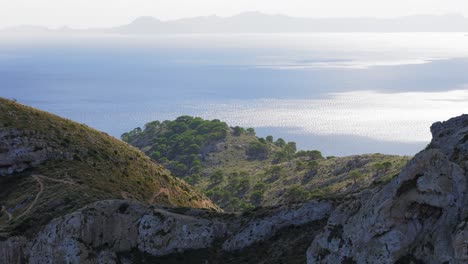 cinematic aerial footage of winding mountain road and mountains, mallorca