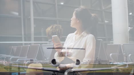 Animation-of-plain-in-the-air-hangar-over-women-using-smartphone