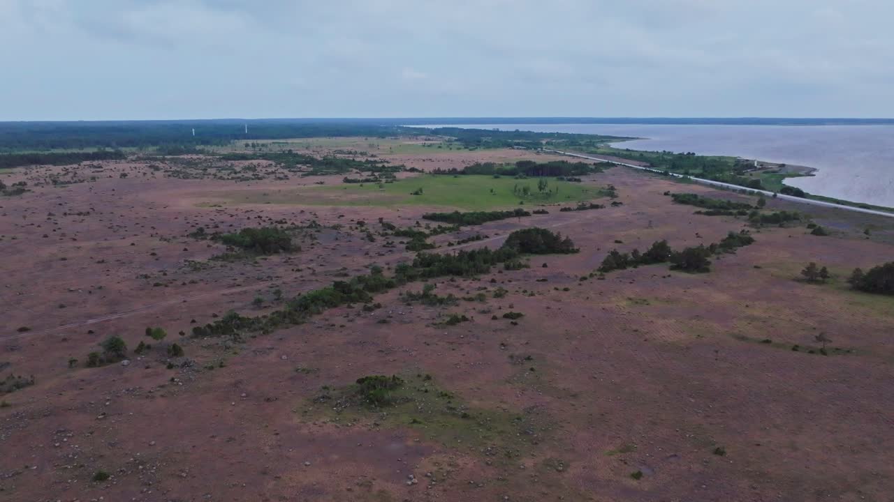 Flying over an alvar near the coastline on a cloudy day