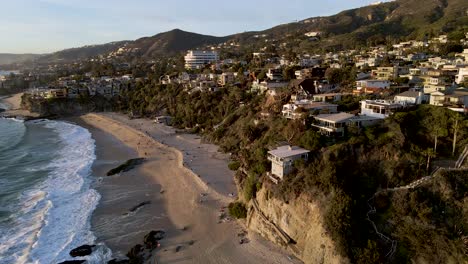 beautiful sunset lighting on luxury buildings on cliff over the thousand steps beach in california