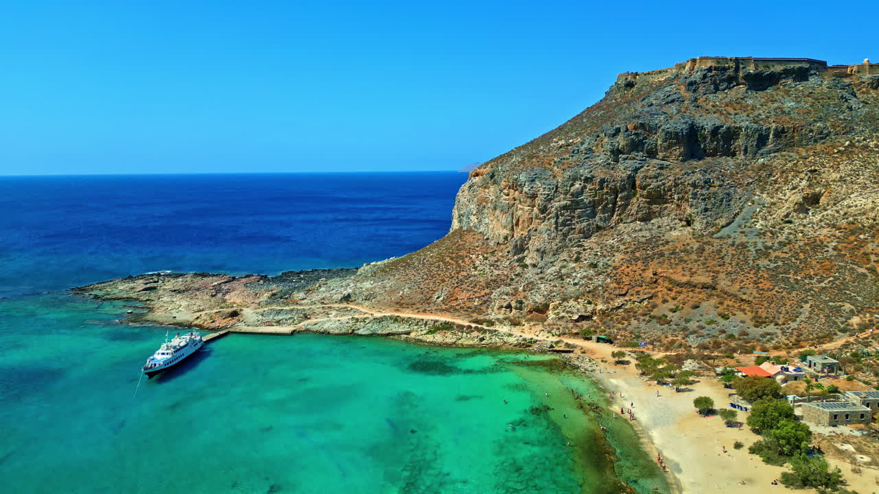Aerial view of magical turquoise waters, lagoons, tropical beaches of pure white sand and Gramvousa island on Crete, Greece.