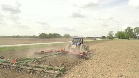 farmer in tractor cultivating crop in field take 7