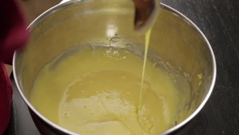 Children-making-a-cake-at-home,-close-up-soft-focus