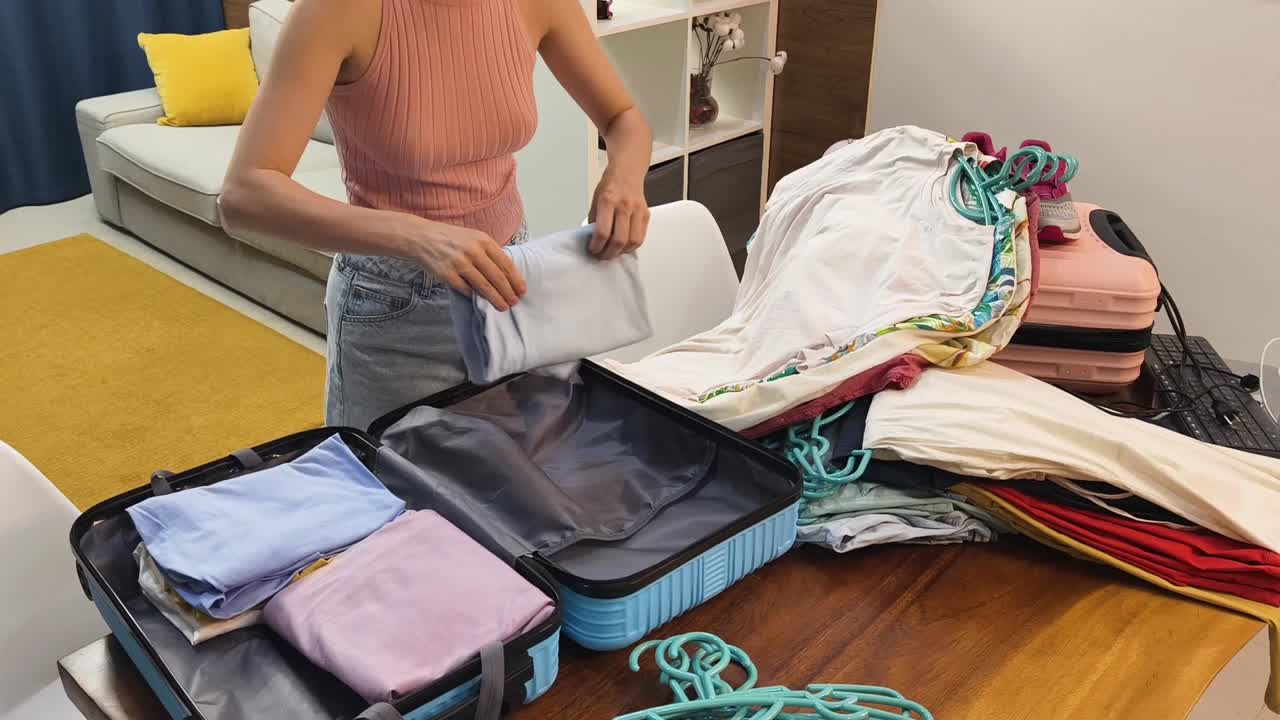 Woman packing a suitcase for a trip