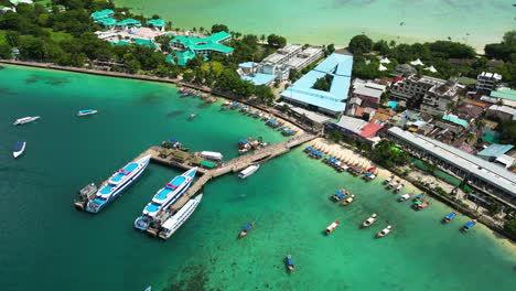 mega yachts moored near koh town in phi phi, aerial drone view