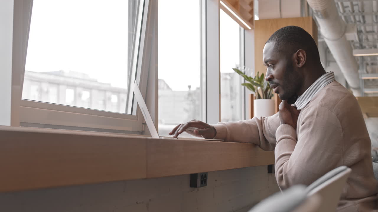 Afro American Businessman Working in Cafe