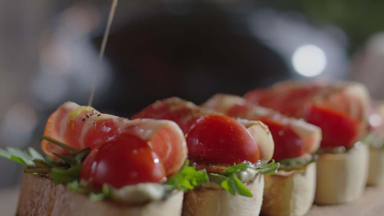Adding Olive Oil to Bruschettas
