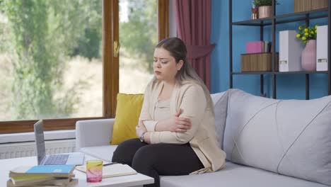 depressed young woman. the young woman is watching out the window.