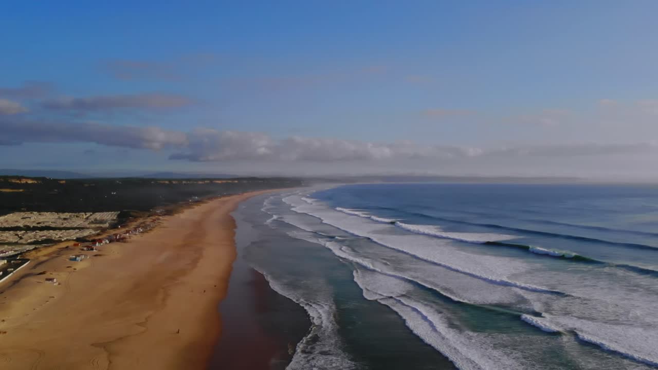 Drone shot of the ocean hitting land in Portugal