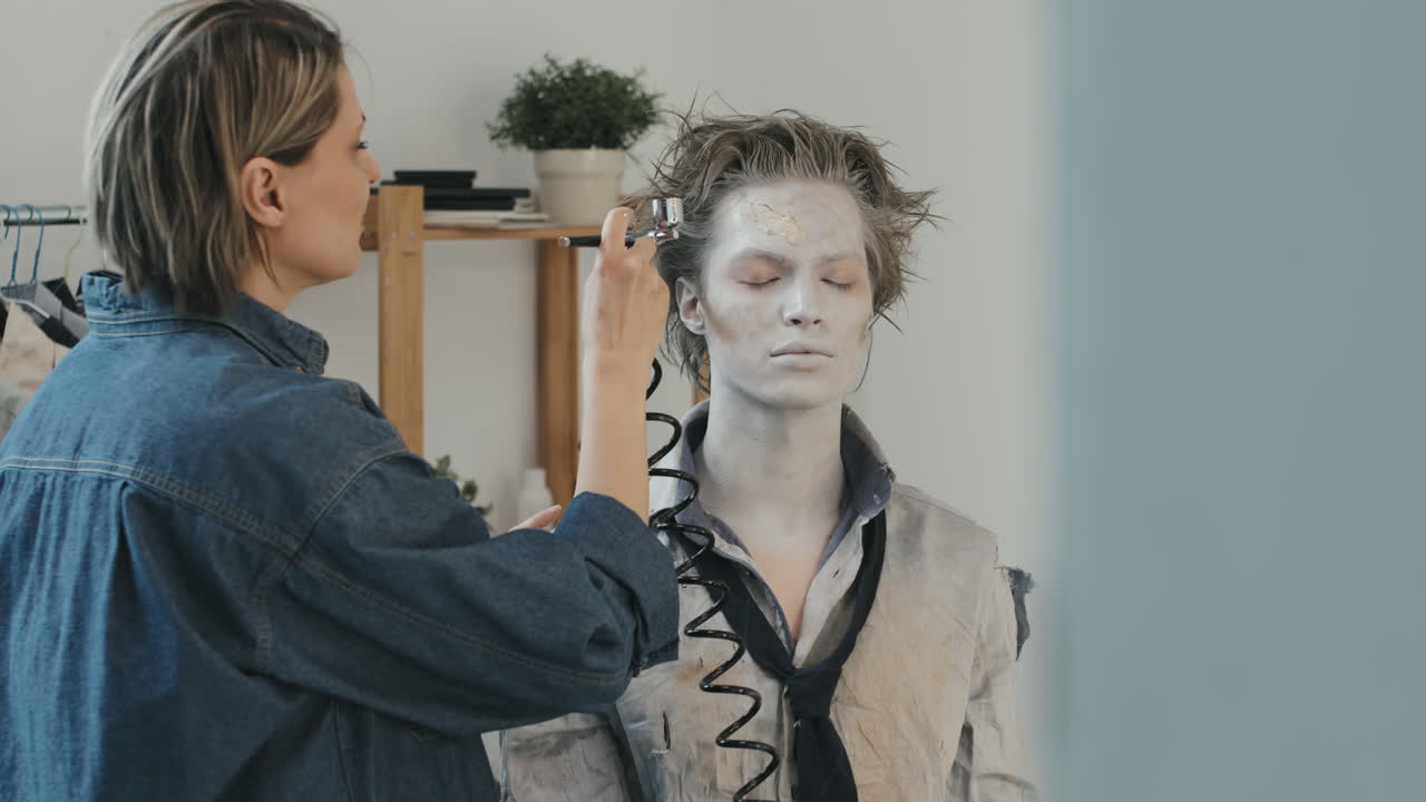 Professional SFX Artist Putting Scary Makeup on Man