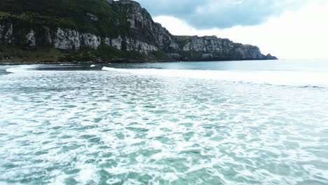 low fly over waves in parakanui bay