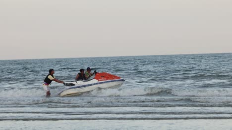 two people riding a jet ski across the sea