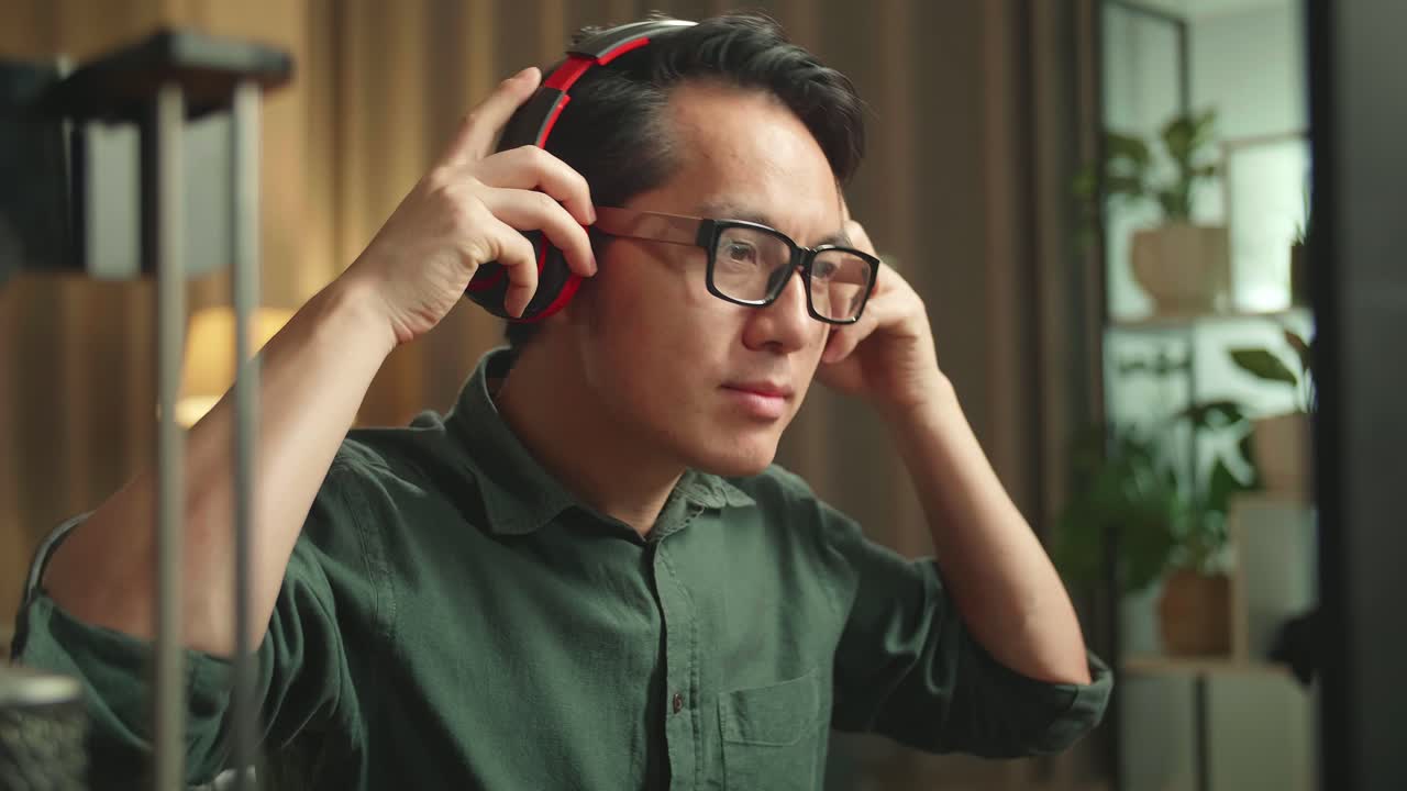 Asian Man Start Works On Personal Computer And 3D Printer In Home Office, He Works At Night