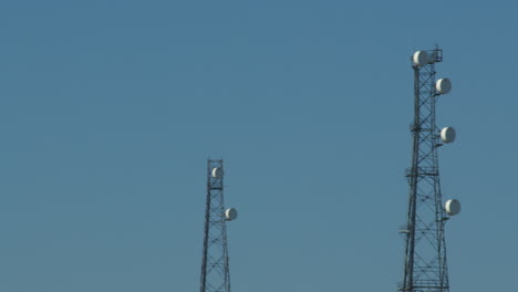 panning mid shot of shot of a communication mast tower at bacton
