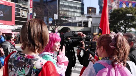 cosplayers engaging with photographer outdoors