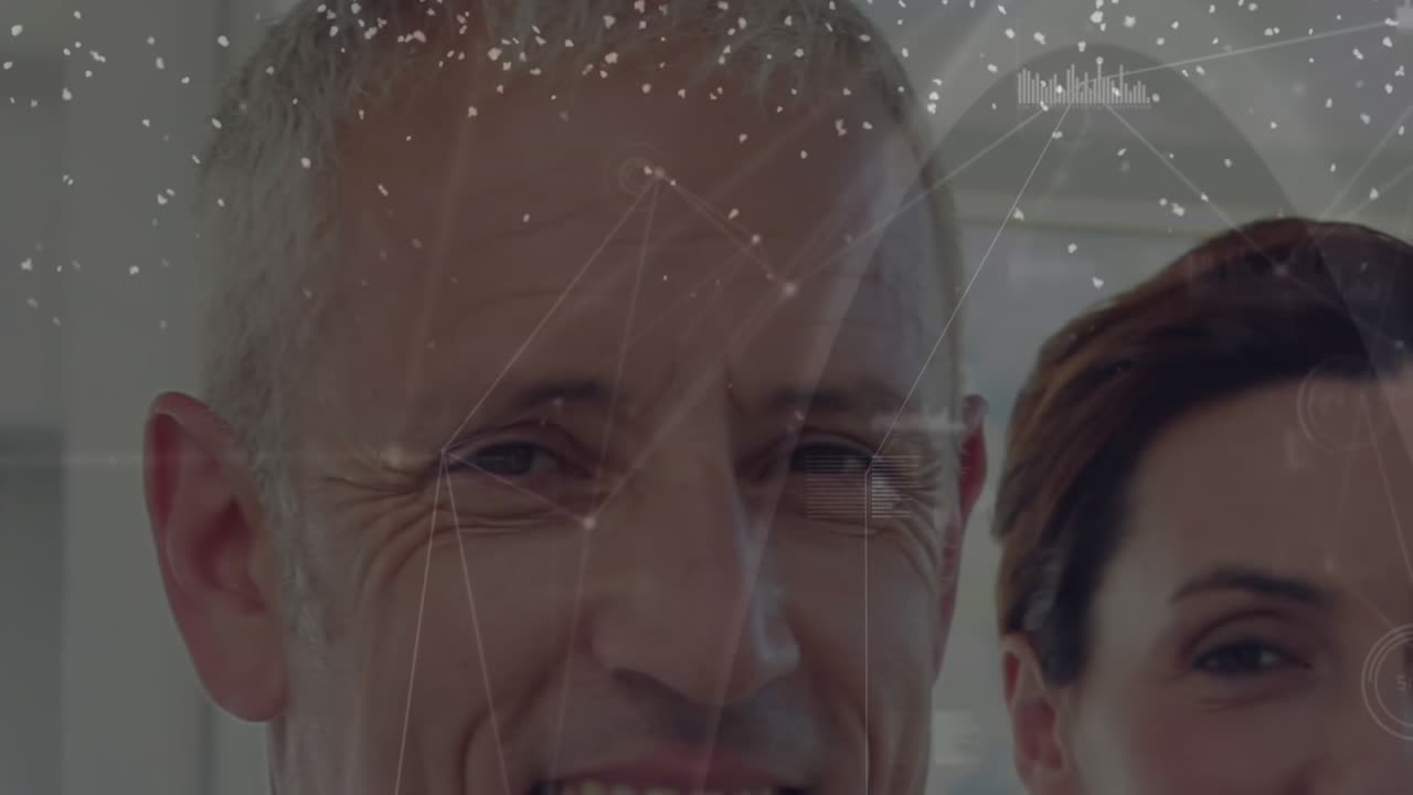 Animation of network of connections over caucasian doctors smiling