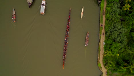 aerial top down view of several boats including vallam kali traditional race boat in kerala