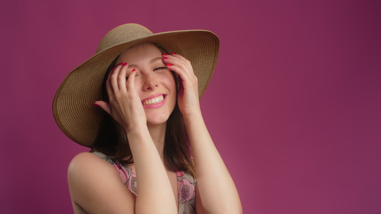Woman Wearing a Straw Hat and a Pink Dress