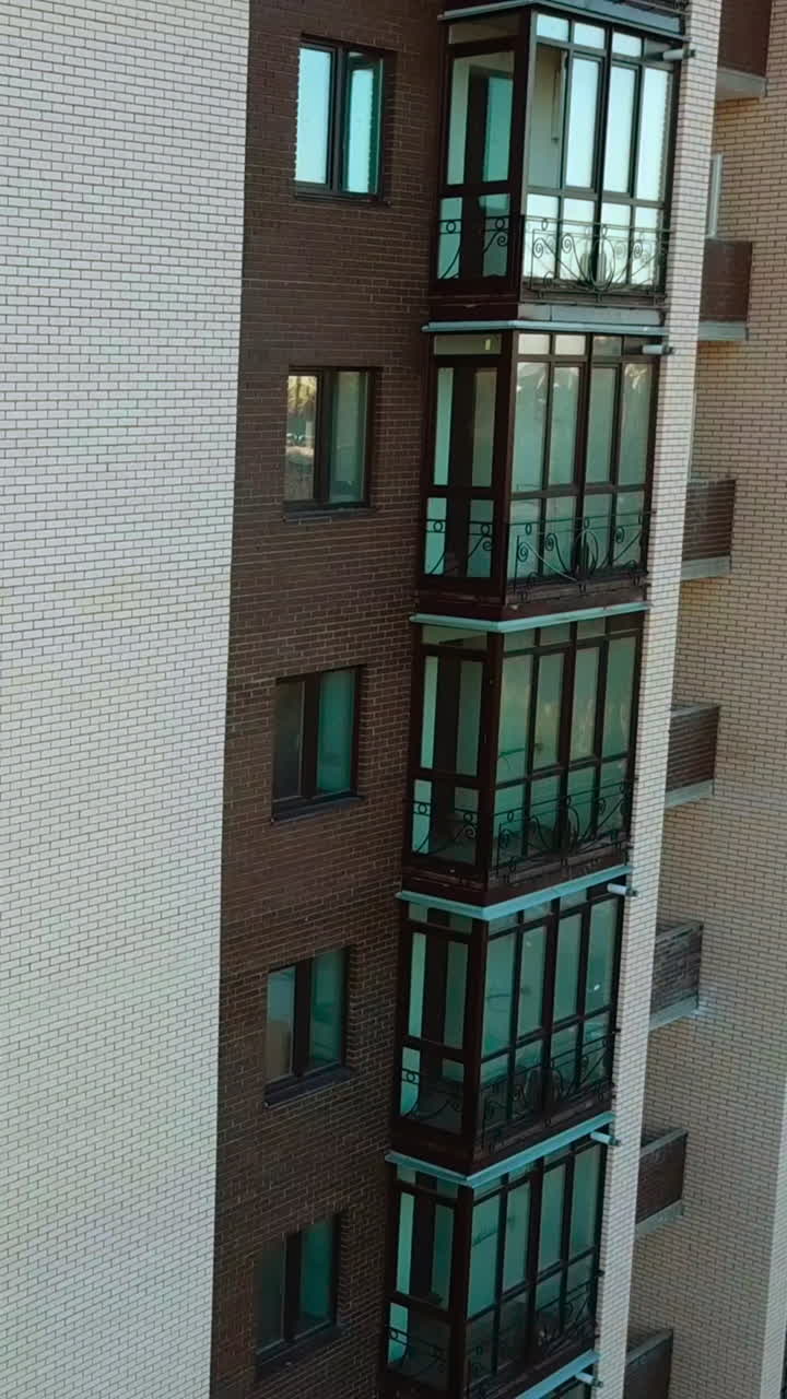 Building under construction. Aerial view of tall buildings under construction Vertical video