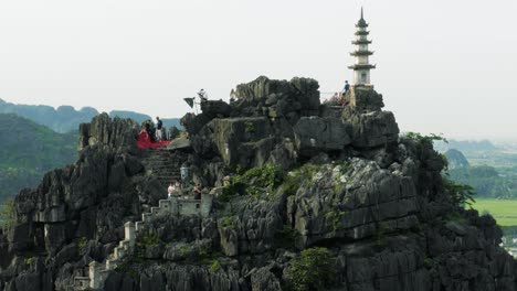 Fashion-Photoshoot-on-the-Top-of-Hang-Mua-Karst-Mountains-in-Ninh-Binh,-Vietnam