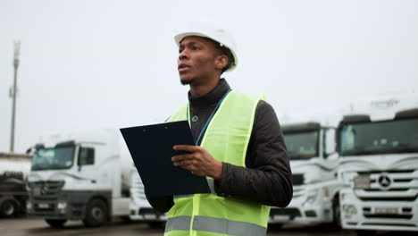 worker writing on clipboard