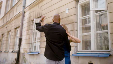 interracial couple dancing salsa in the old town street 6