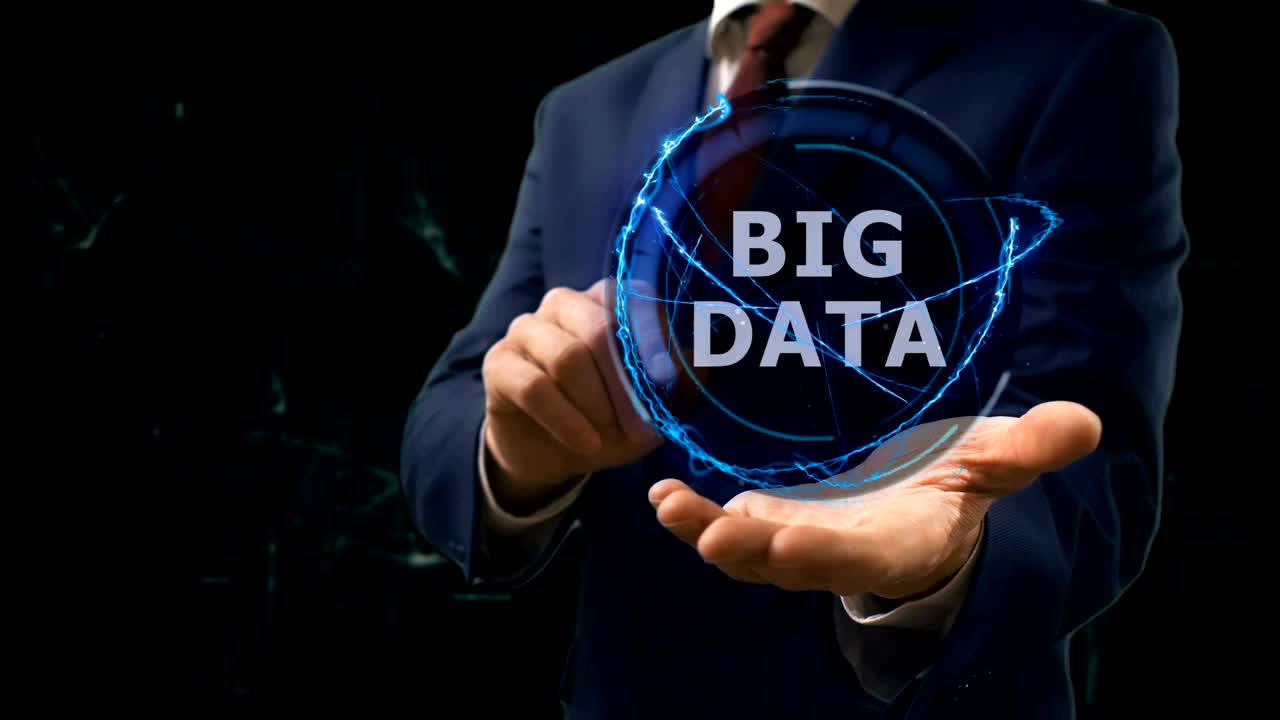 Businessman shows concept hologram Big Data on his hand