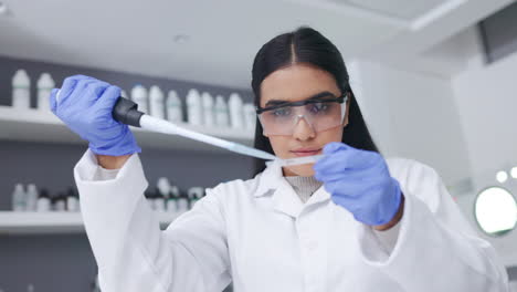 Young-female-scientist-doing-research-to-find