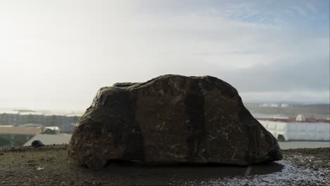 snow falling in front of rock in northern canadian city