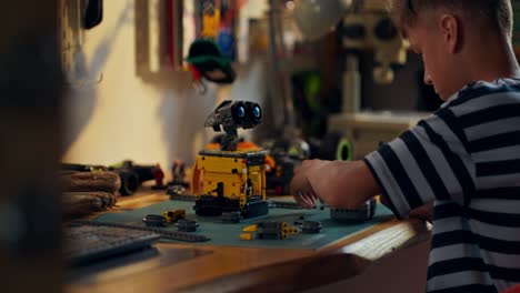 boy building a robot toy