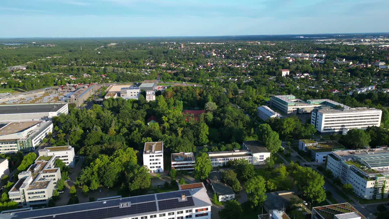 several tennis courts nestled within a dense forest providing a tranquil escape in the heart of the city Berlin. Brilliant aerial view flight speed ramp hyper motion time lapse fly push forward drone