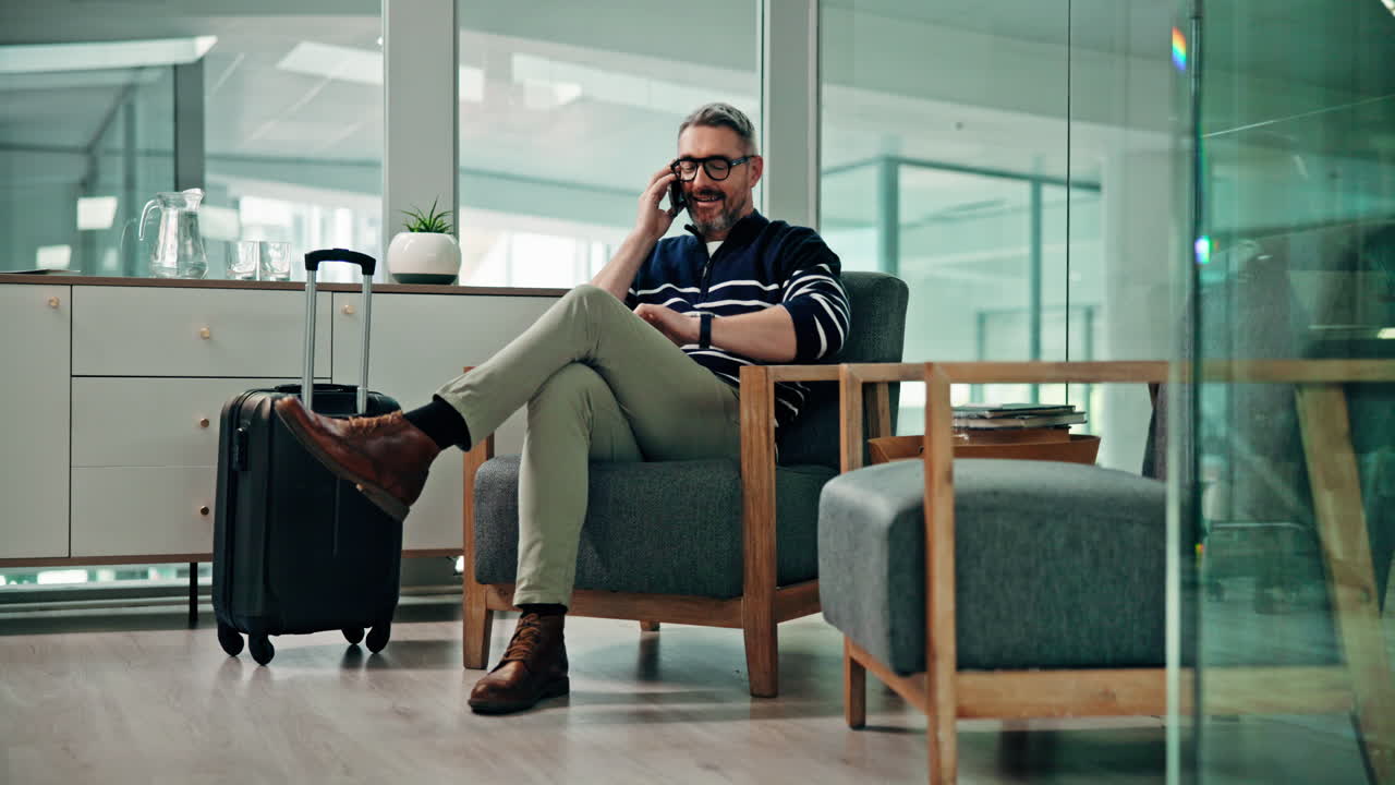 Businessman on a Phone Call in a Waiting Room
