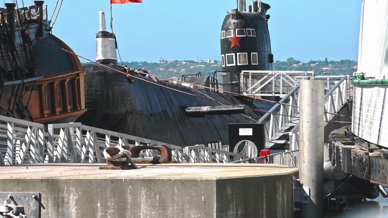 A submarine floating on the blue waves in a sunny day