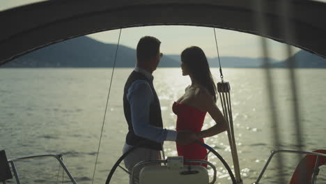 couple on a yacht at sunset