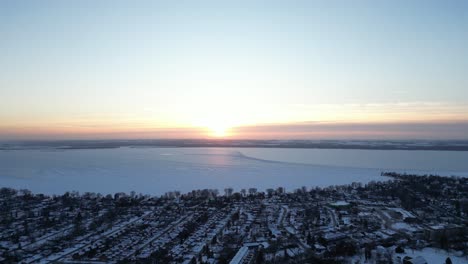 golden hour by the great lakes during winter time and sunset