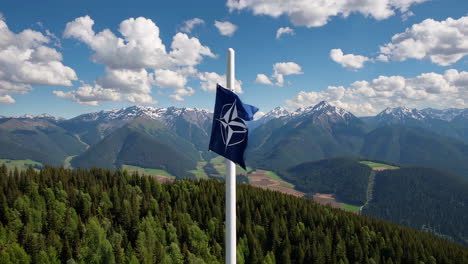 nato flag in the mountains