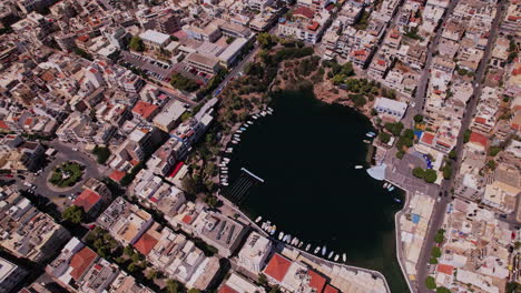 aerial view of a harbor surrounded by urban landscapes during daytime