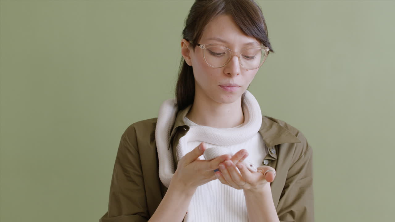 Office Worker Wearing Glasses And Typing On The Laptop In The Office At Night