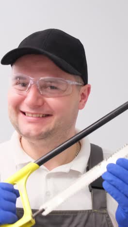 man with a hand saw