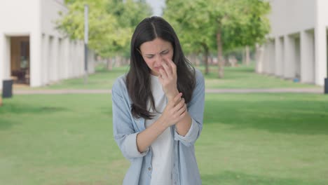 Sick-Indian-girl-suffering-from-hand-pain