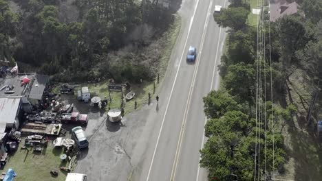 Woman-runs-by-side-of-busy-road