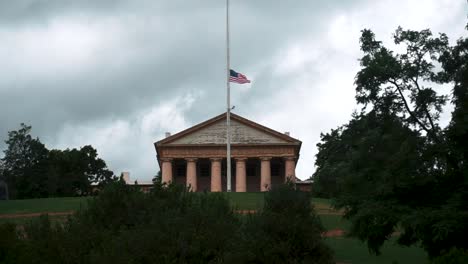 Arlington-House-With-Flag-At-Half-Staff-Waving-Against-Cloudy-Sky-In-Arlington,-Virginia,-Washington-DC