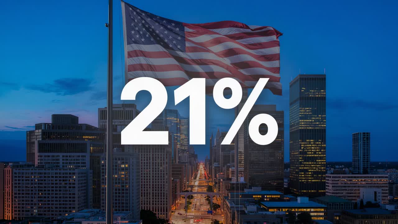Displaying white 21% graphic centered over downtown avenue, American flag waving in light wind