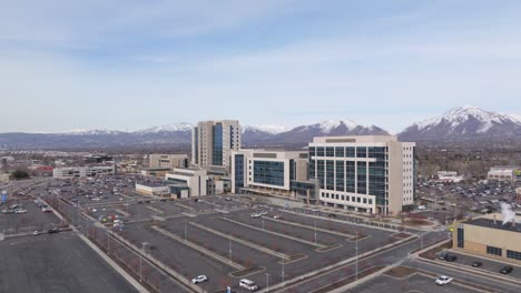 flying over intermountain medical center parking lot in murray utah - establishing shot