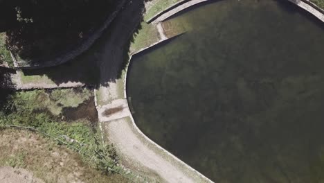 Aerial-view-of-a-portuguese-lake-in-Macieira-de-Alcoba,-Águeda,-Portugal